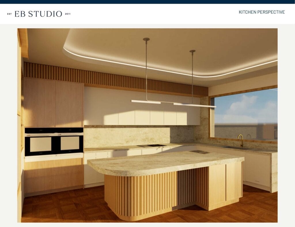 The modern kitchen, complete with a marble countertop island, built-in overhead lighting, and integrated appliances, is bathed in natural light from a large window, while Emma Blomfield stands by admiring the sleek design.