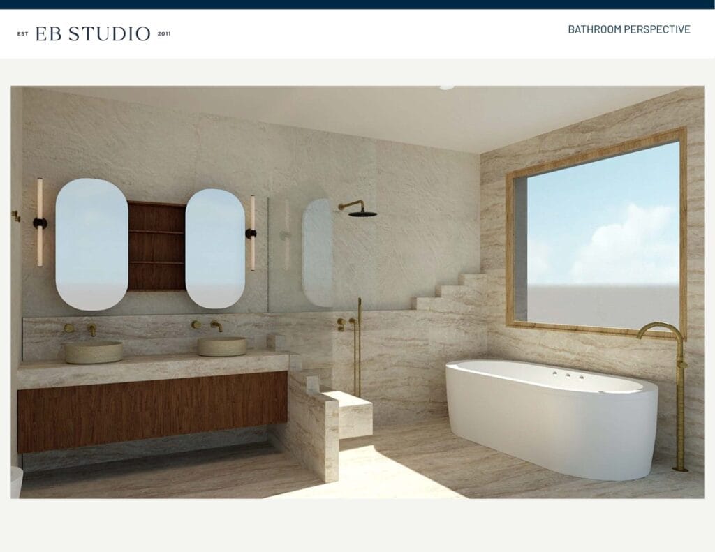 Emma Blomfield's modern bathroom boasts double sinks, a large bathtub, a walk-in shower, and a window with a view, all set against light stone walls and floors accented with wood and brass.